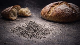 Ash Wednesday Ash with Bread on Dark Surface