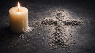 Ash Wednesday Candle and Ash Cross on Dark Surface